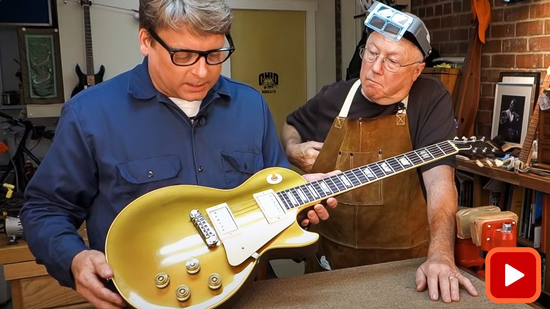 Two people holding goldtop guitar