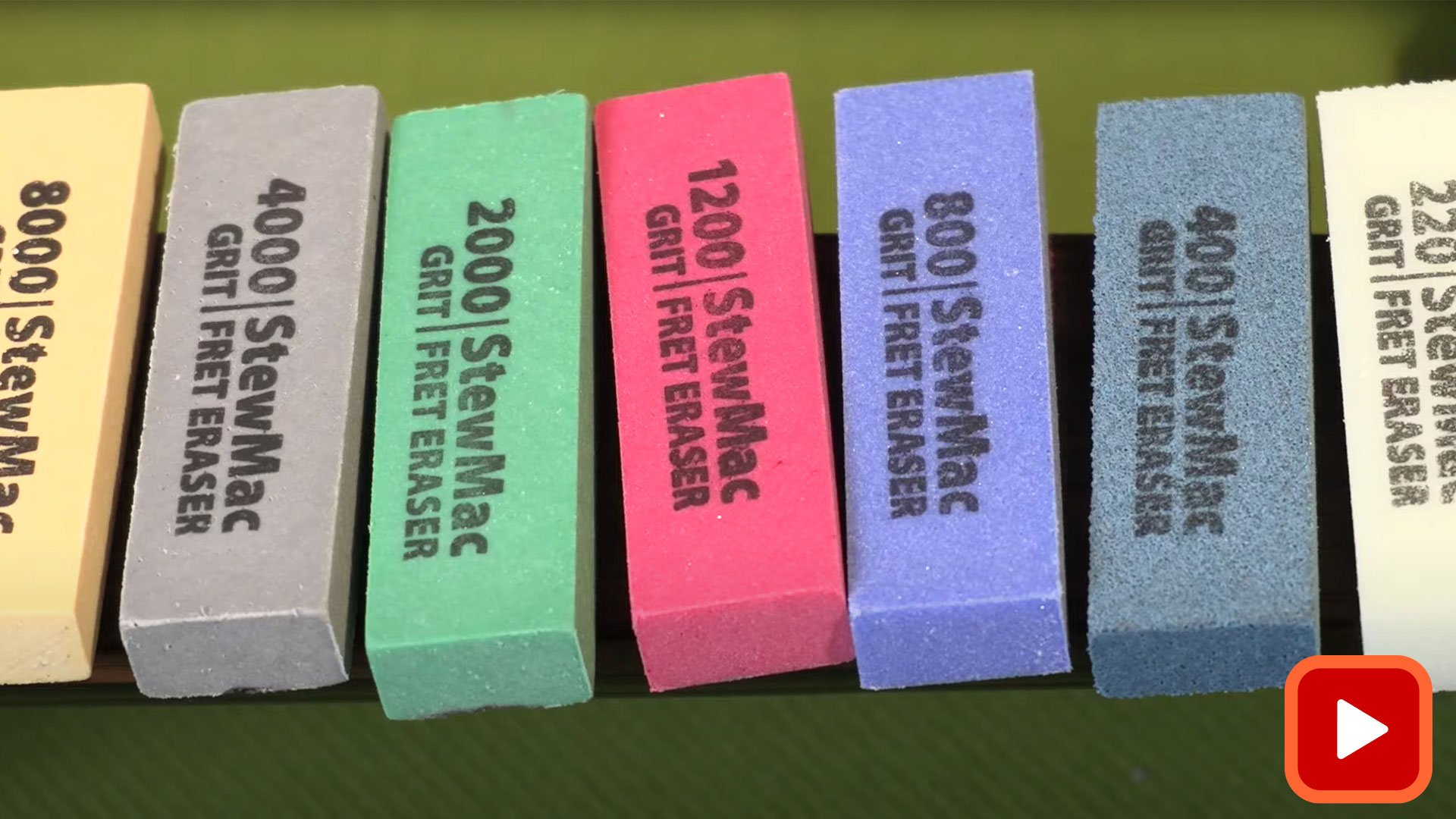 Fret Erasers lined up showing different grits and colors