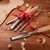 Set of wood chisels on a work bench with gift ribbon.