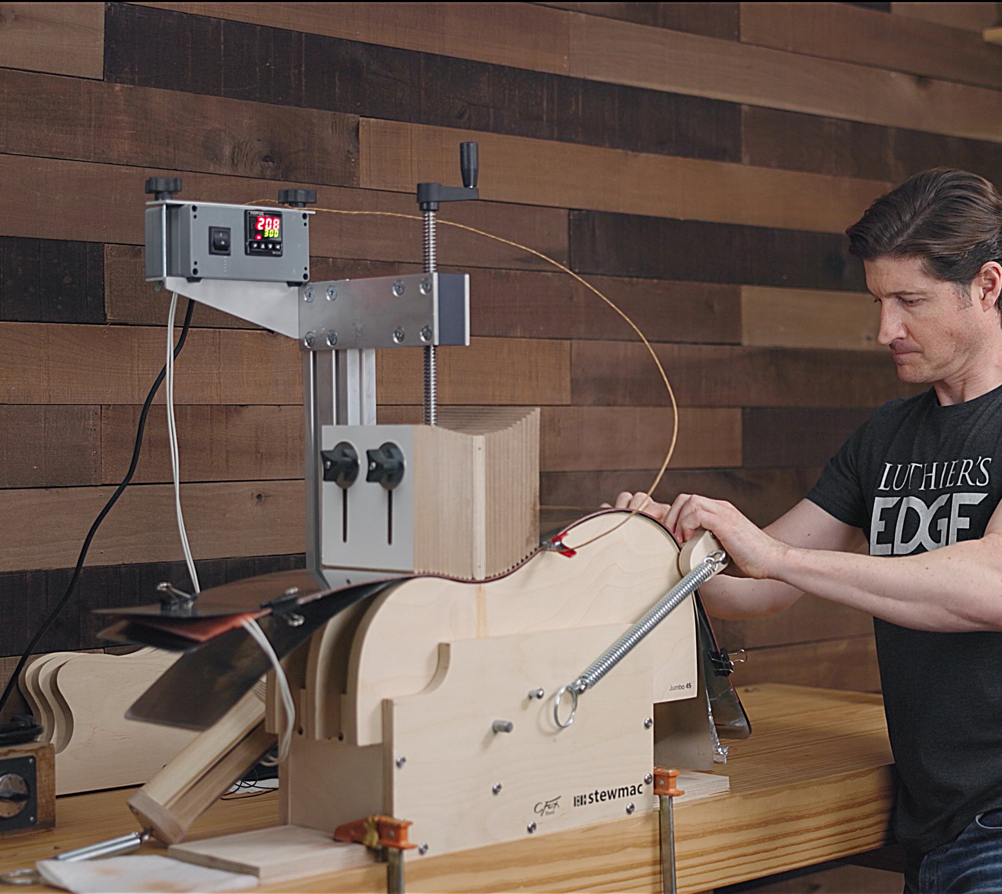 Luthier Tom Bills in his shop using the StewMac Acoustic Guitar Side Bender.