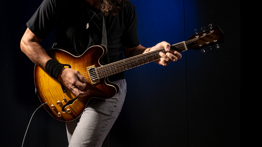 Rock star playing a Les Paul style guitar