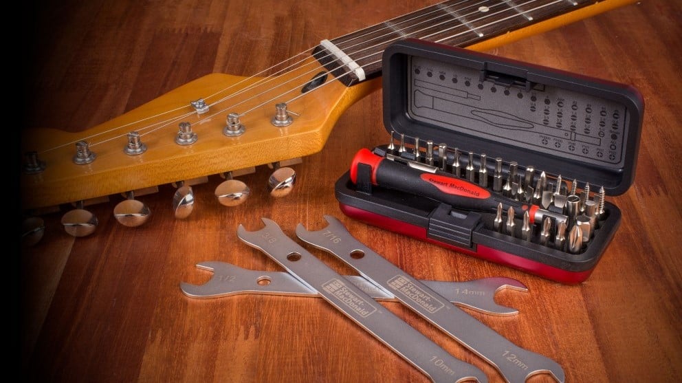 Guitar tech tools on workbench.