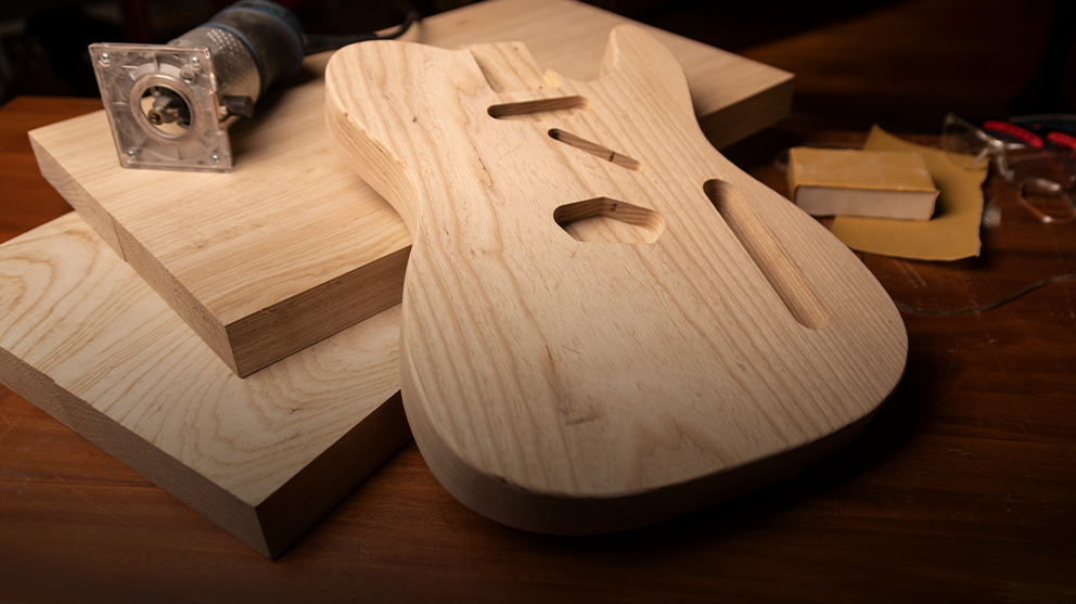 Swamp ash guitar body in the shape of a Telecaster.