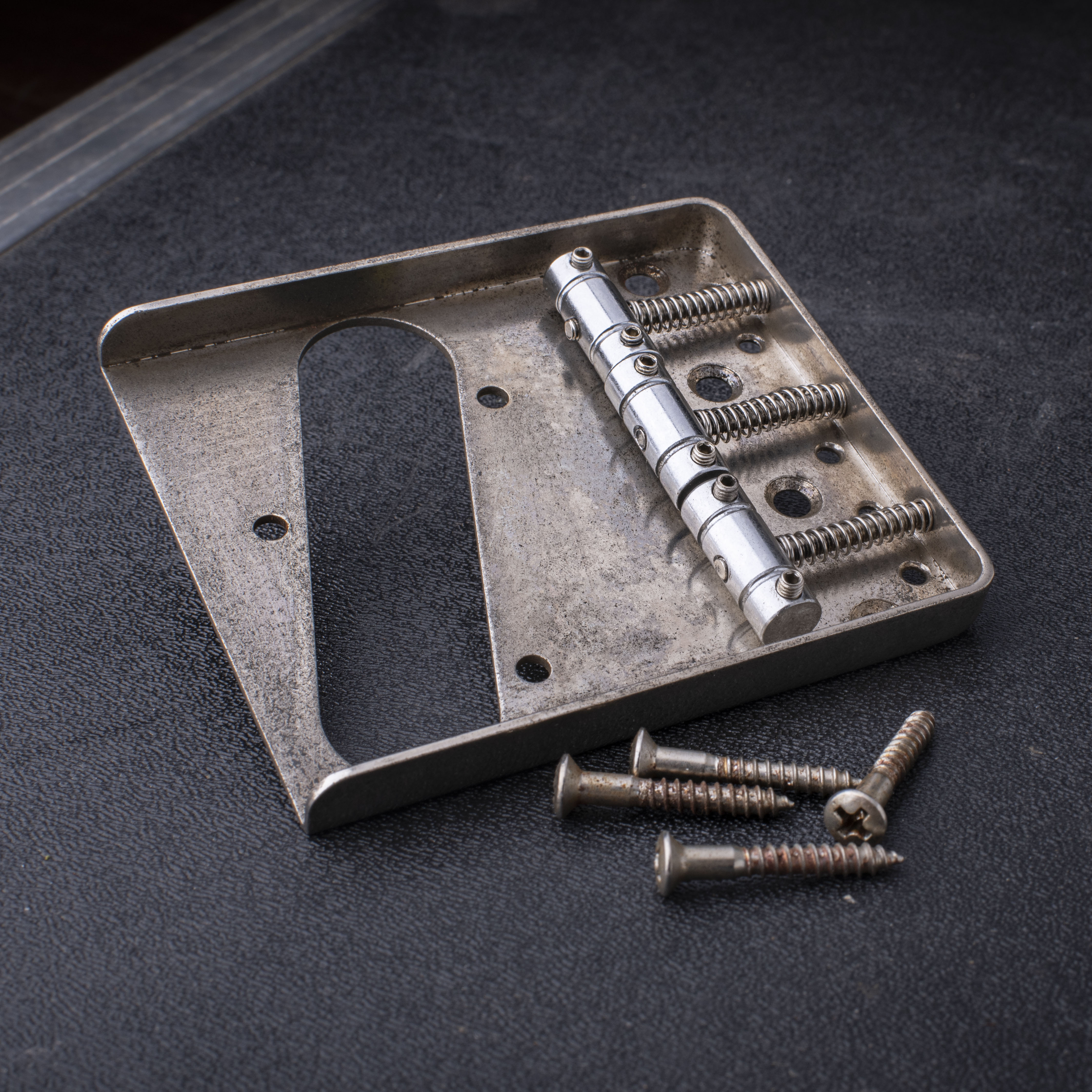 GuitarSlinger Cryocated Aged Bridge for Tele with Grooved Barrel Saddles