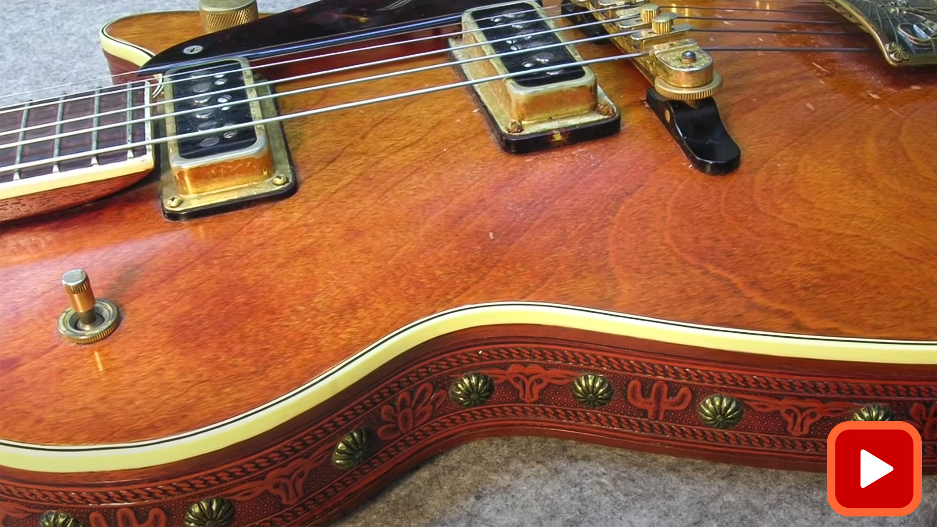 Side of guitar showing binding and leather sides