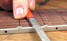 Photo: shaping the fret nibs