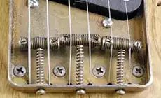Clean up your old electric guitar saddles - StewMac