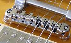 Roller bridge with a Bigsby vibrato