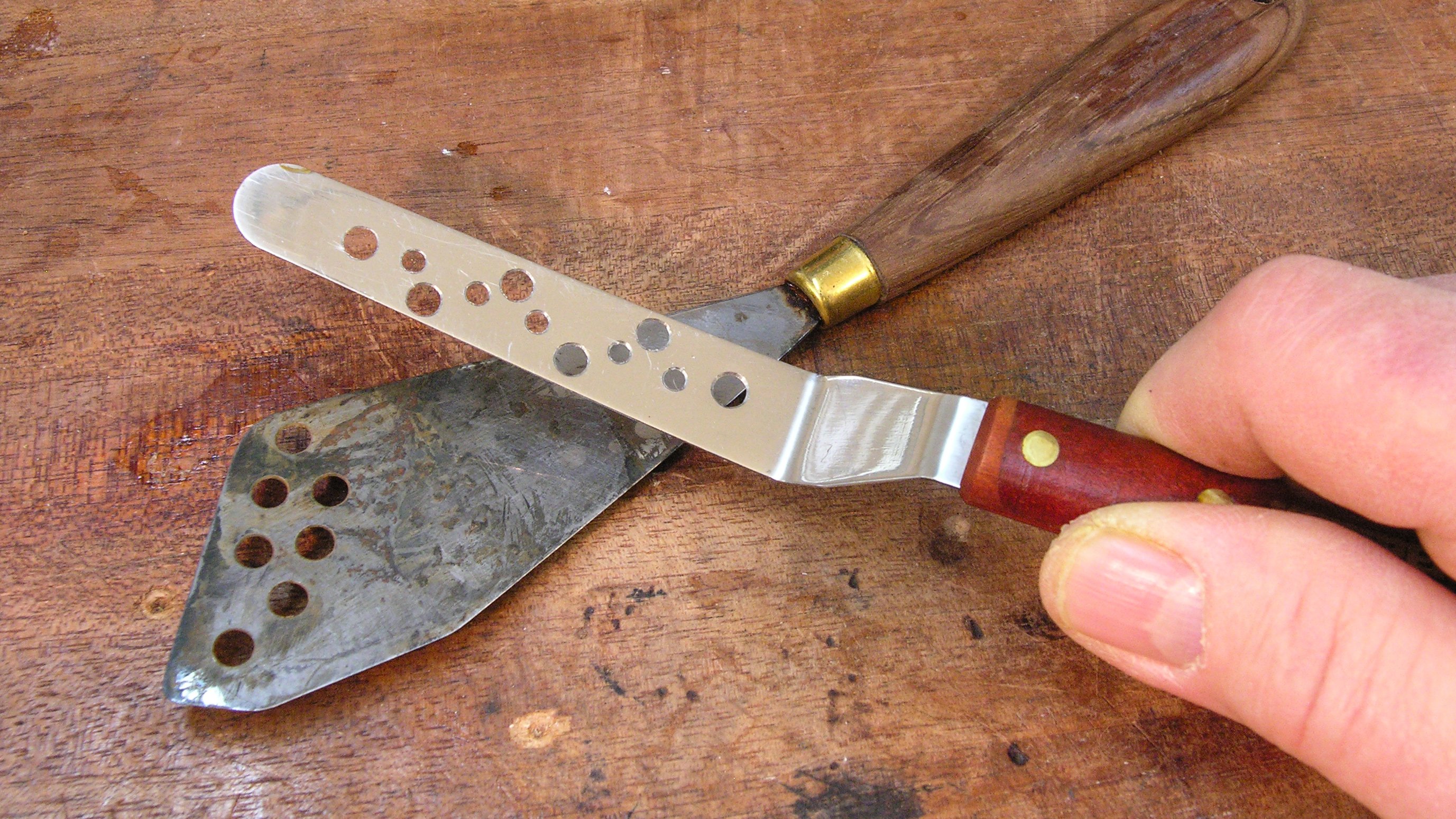 Using a "swiss cheese knife" to fix the back on a 1923 Gibson Using a "swiss cheese knife" to fix the back on a 1923 Gibson