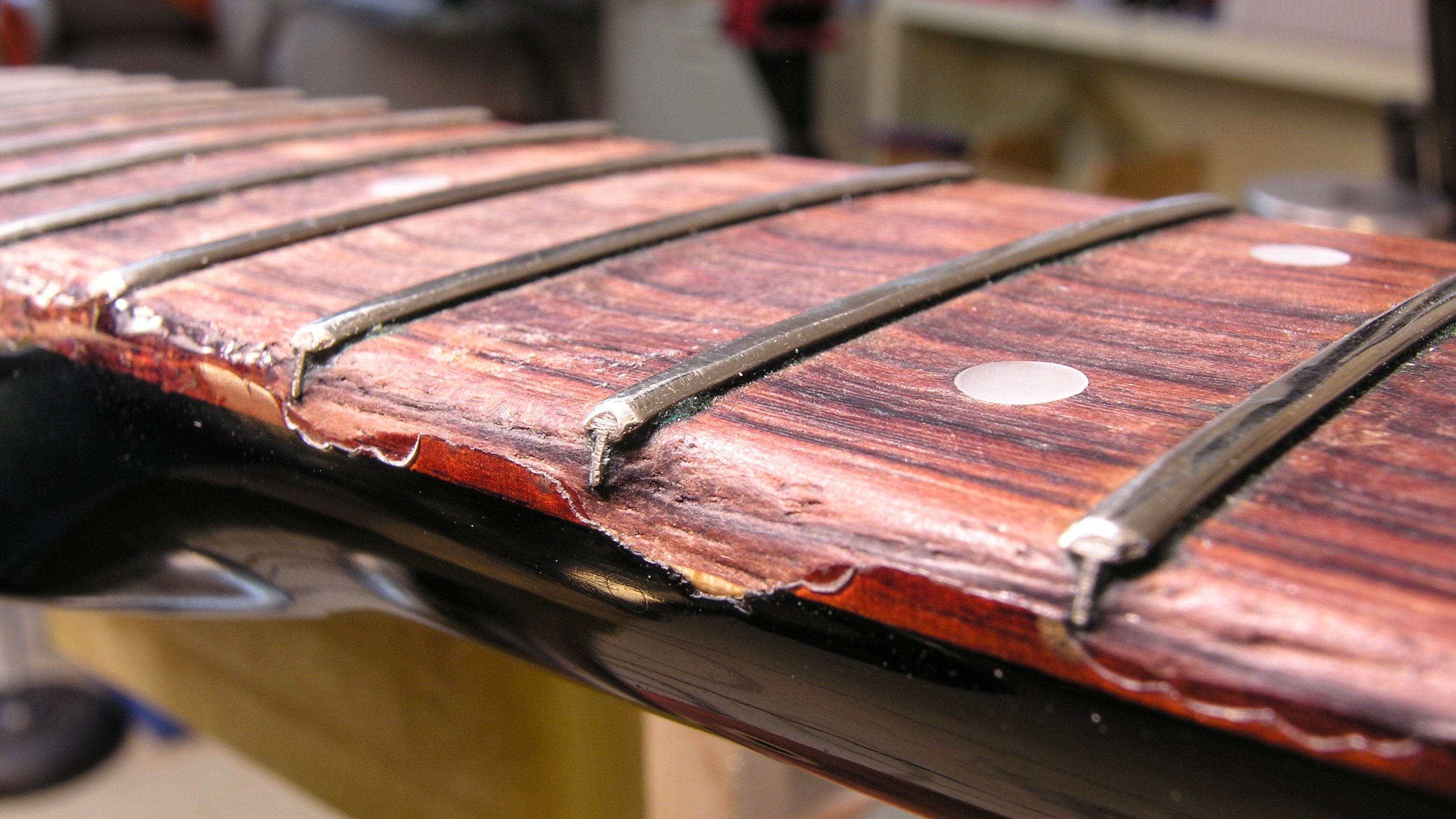 Fixing a badly worn neck: super glue as both fill and finish