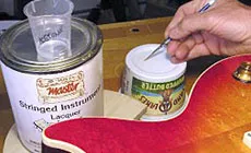 Lacquer drop fill: hiding a scratch on a customer's Les Paul - StewMac