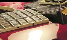 Lacquer drop fill: hiding a scratch on a customer's Les Paul - StewMac