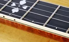 https://www.stewmac.com/globalassets/video-and-ideas/online-resources/hardware-installation/setting-up-a-banjos-5th-string-nut-capos-and-peg/53-setting-up-banjos-5th-string-spikes-for-capos.jpg?hash=637613112110000000&format=webp&quality=80