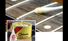 wipe paste wax onto the wooden fingerboard with a Q-tip