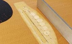 Photo: patched bridge pin holes