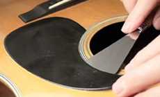 Replacing a shrunken pickguard-removing the pickguard