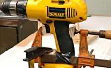 Clamp an electric hand drill to a workbench