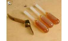 Three pipettes filled with hot hide glue, ready to use