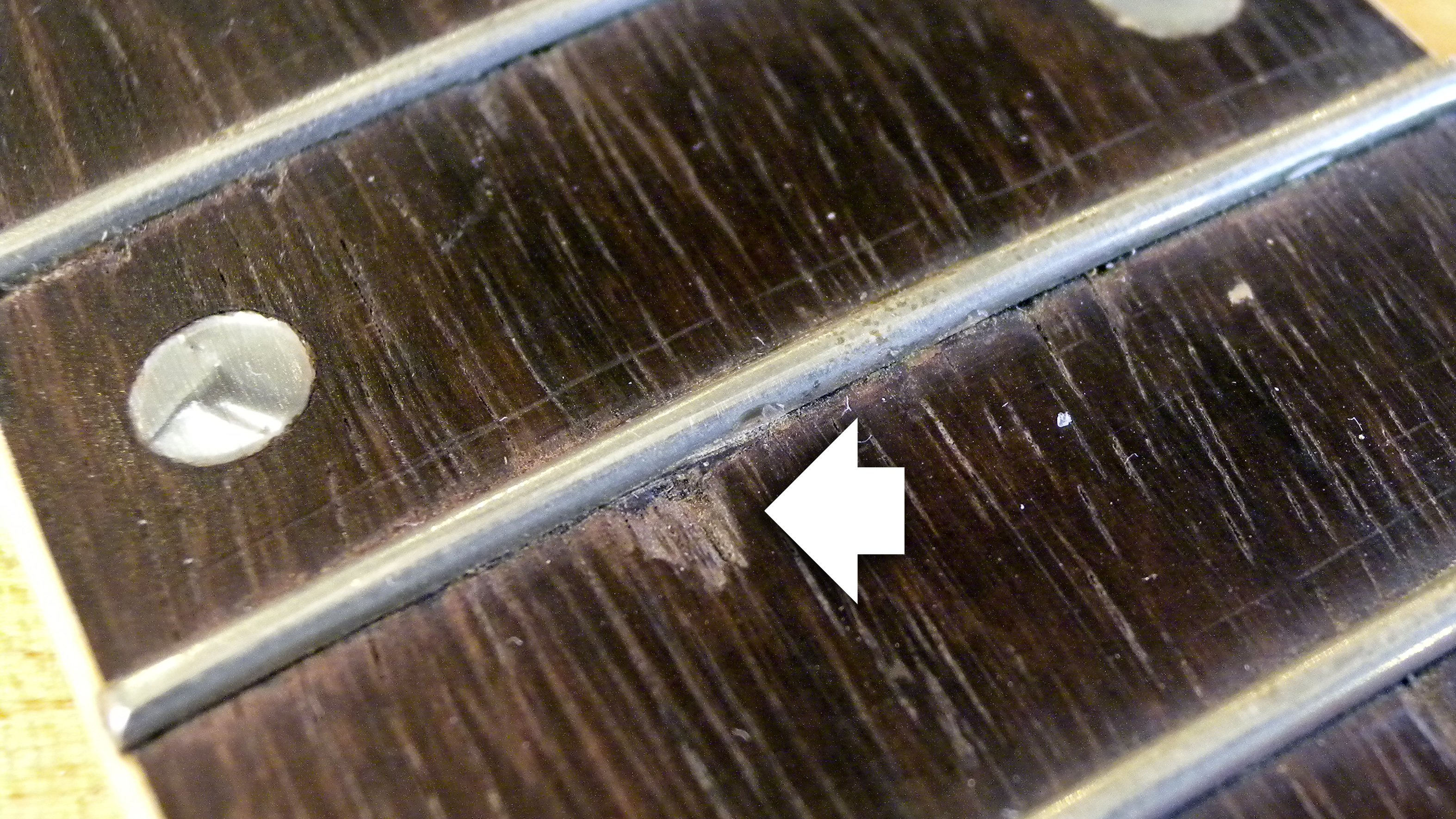 Cleaning up after sloppy fretwork: fixing chips in the fingerboard Cleaning up after sloppy fretwork: fixing chips in the fingerboard