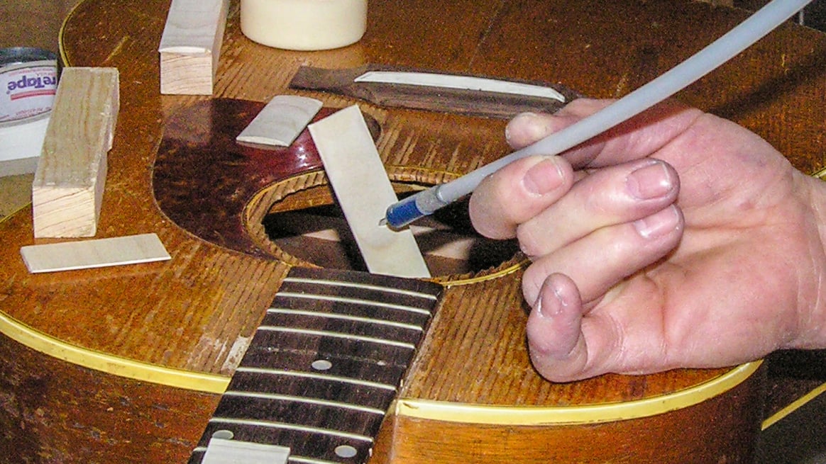 How would you reach inside a guitar to do this gluing? How would you reach inside a guitar to do this gluing?