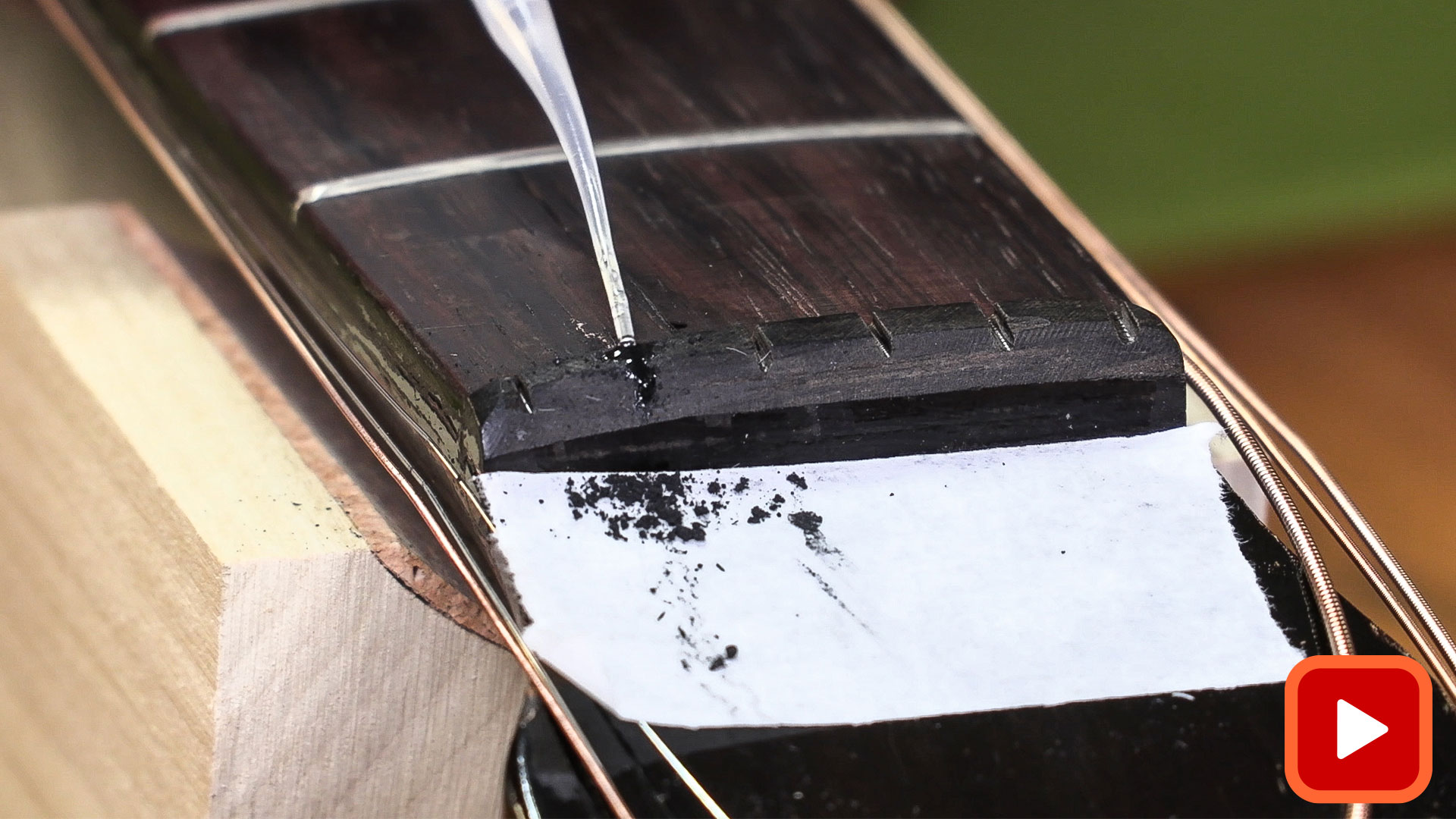 Nut slot filled with powder with glue added