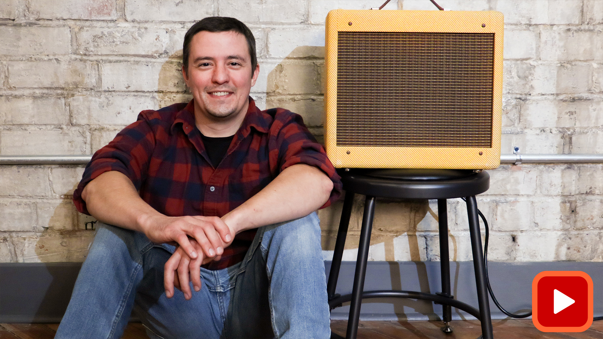 Man sitting next to completed amp kit