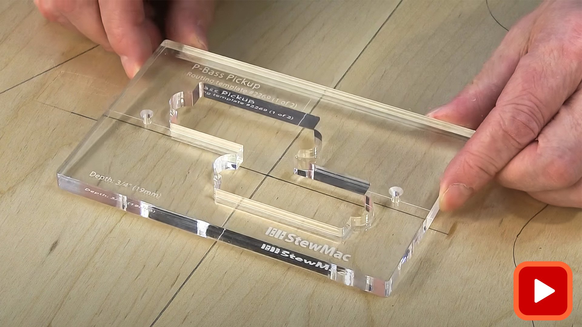 Hands aligning pickup routing template on body blank