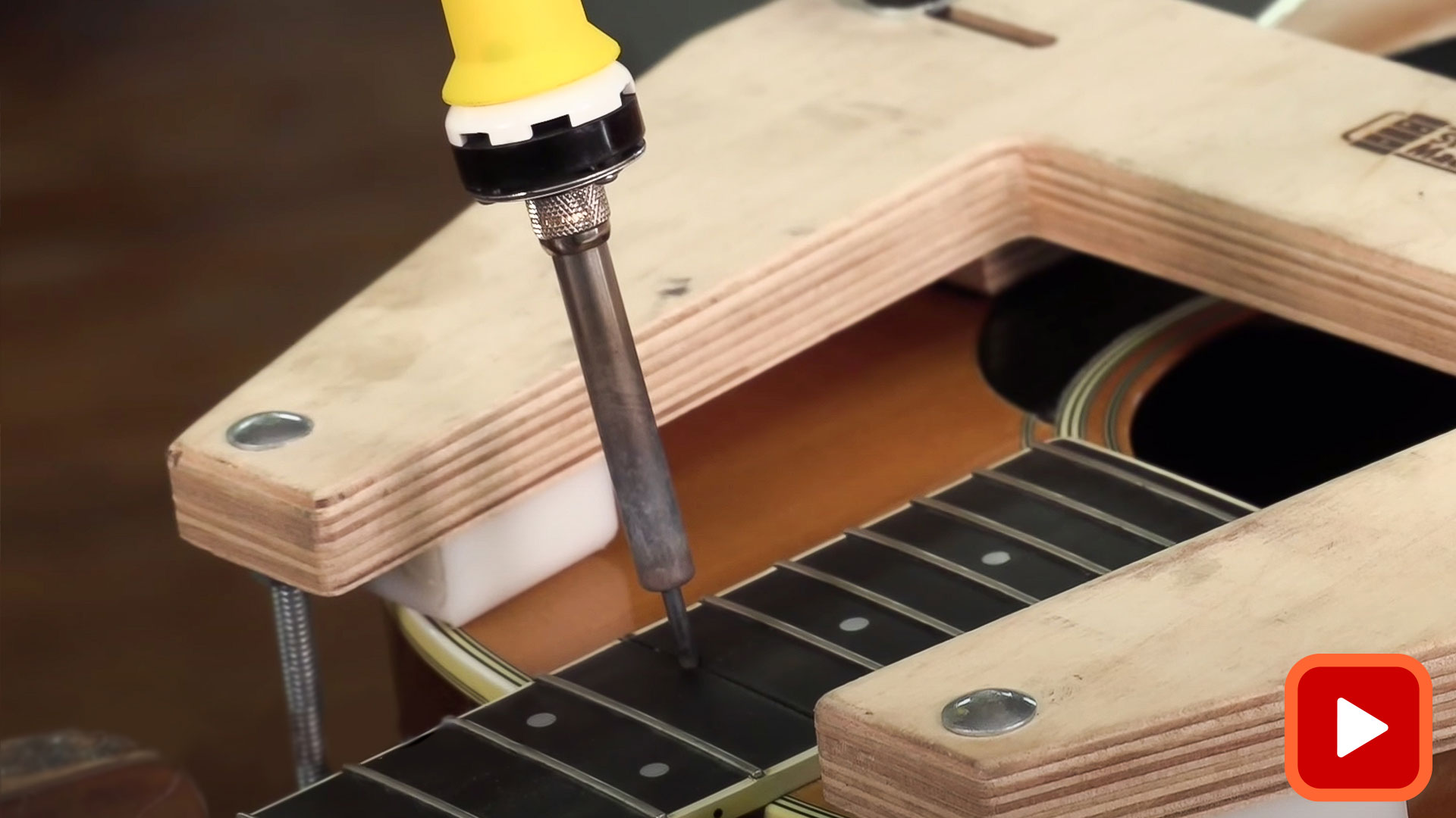 Heat stick and soldering iron in guitar neck joint during reset