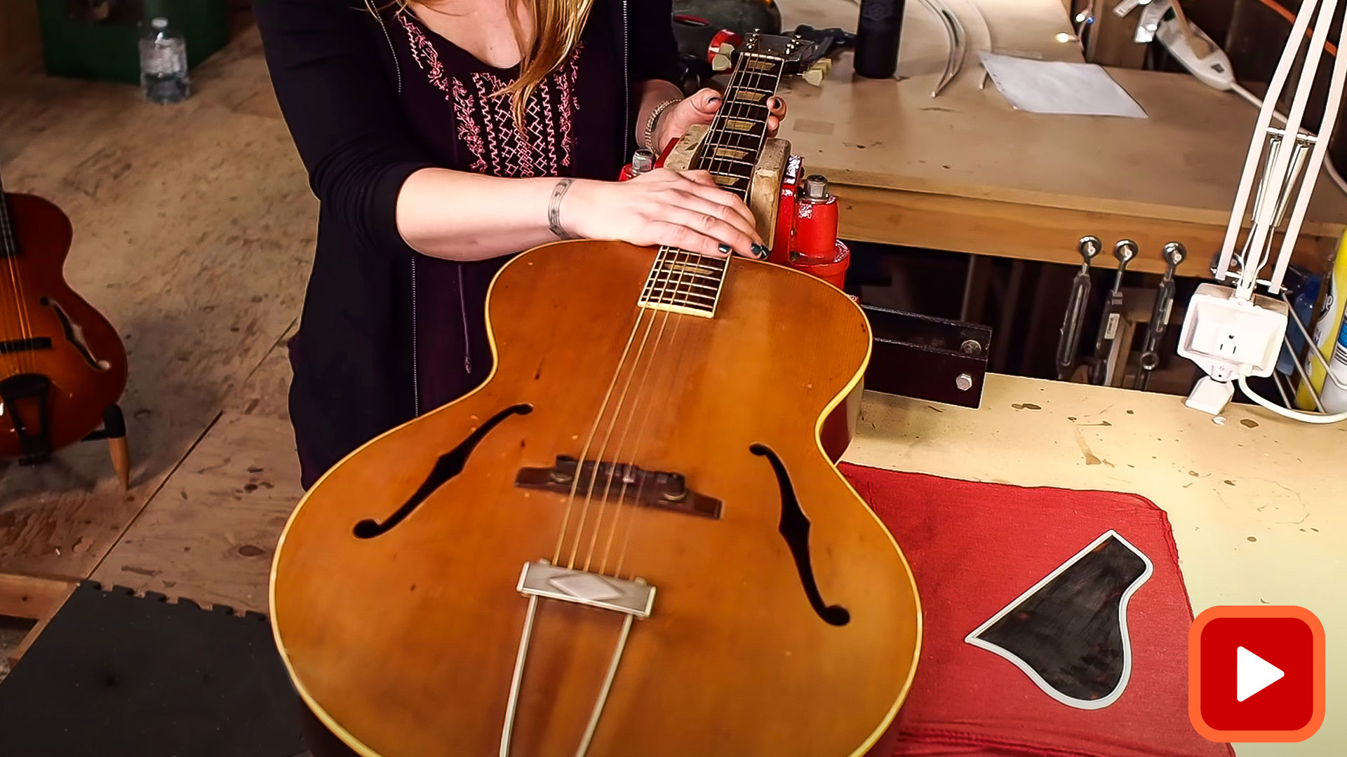 Archtop guitar with neck in vise