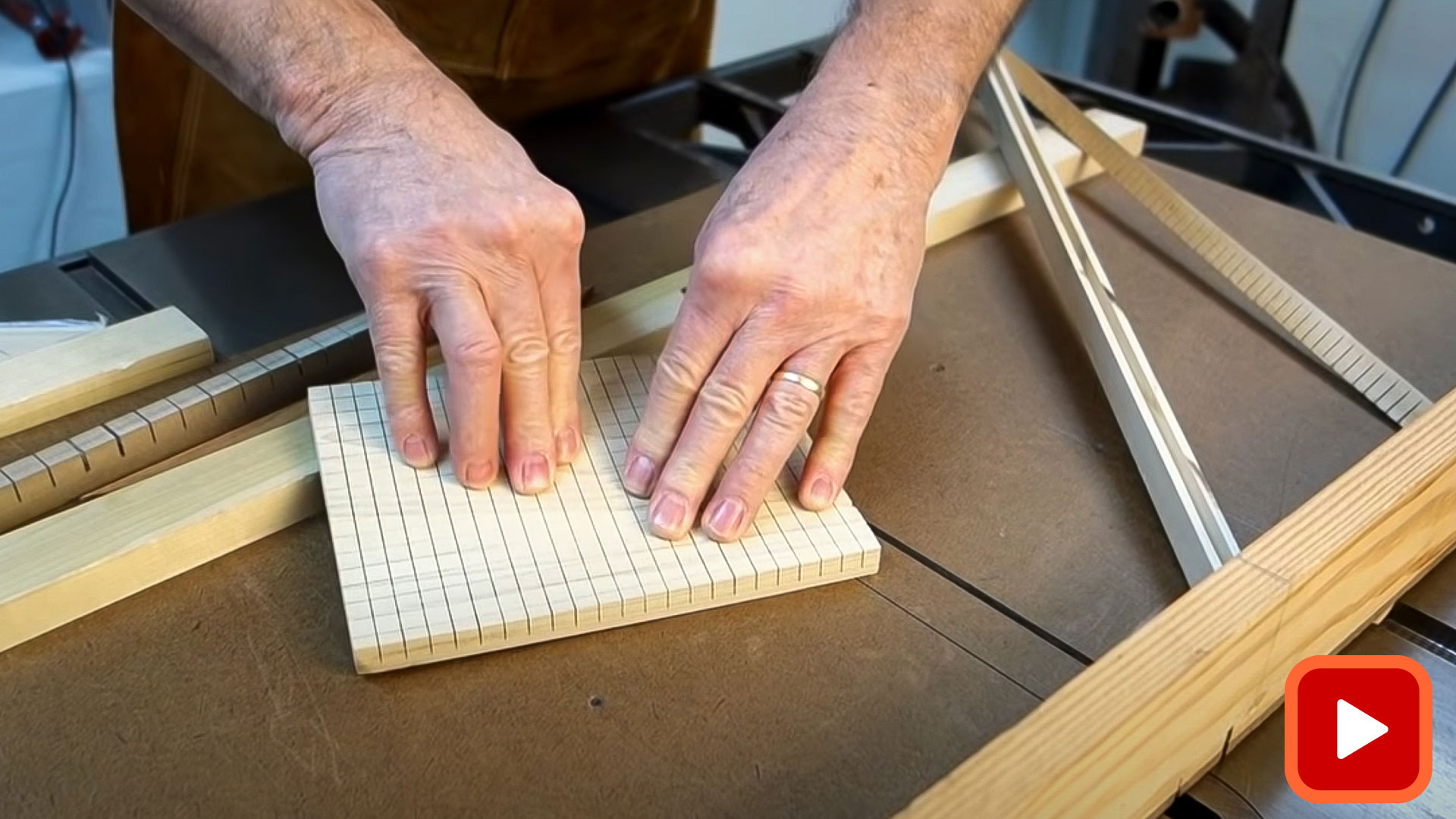 Hands showing flexible caul made on cross-cut saw